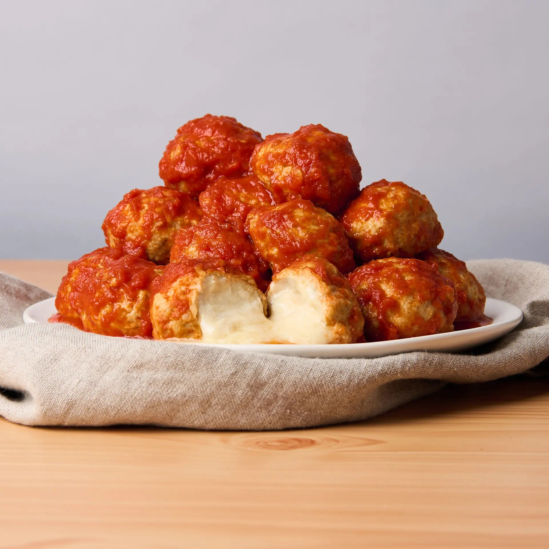 Five-Cheese Stuffed Chicken Meatballs in Italian Style Sauce